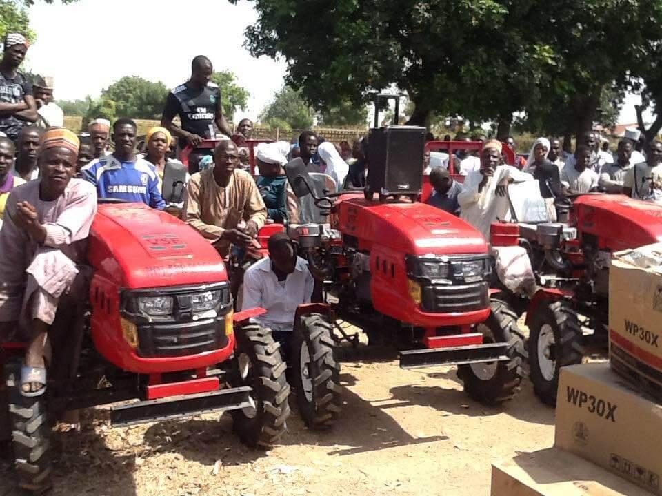 A community leader in Gombi LGA receives a power tiller, dry season farming support, 2018