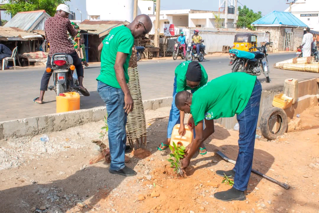 Environmental Care Foundation volunteers planting a tree
